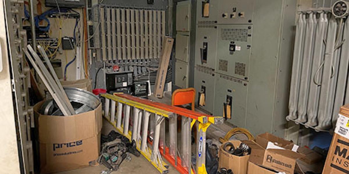 items stored in front of an electrical panel