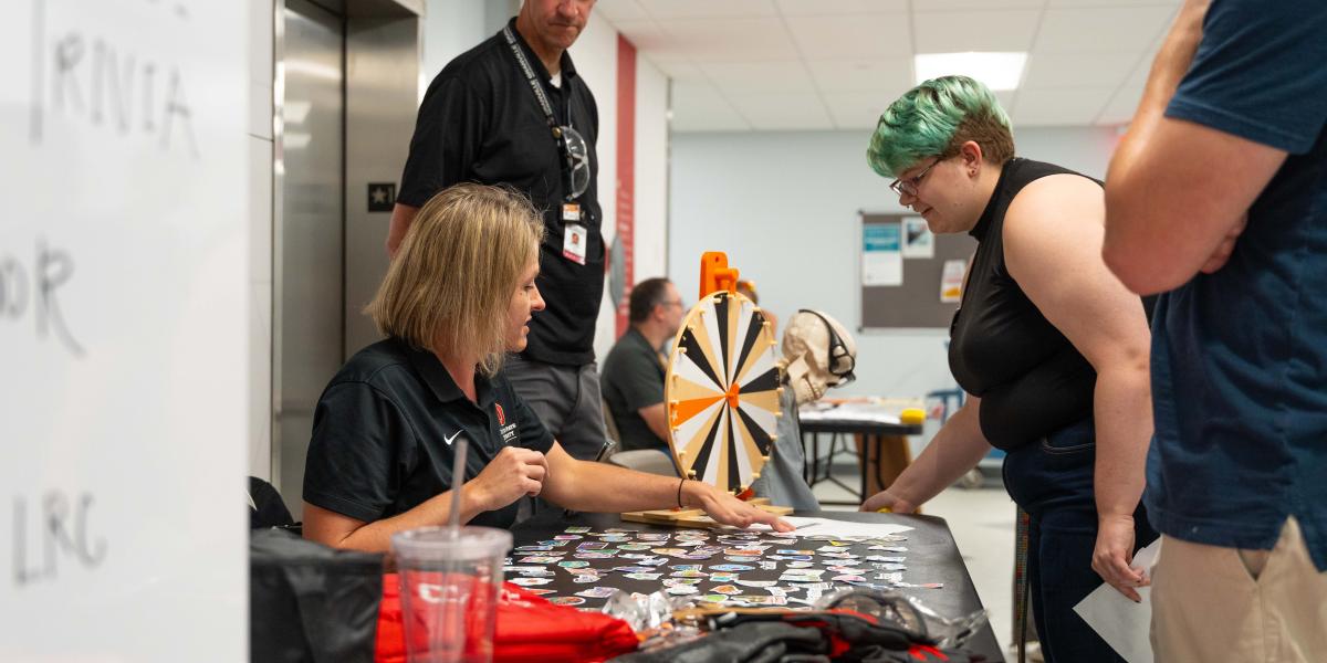 people at prize wheel