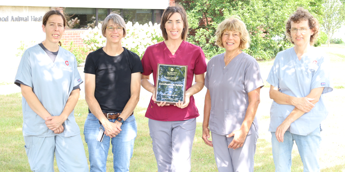group of women outside with lab safety award
