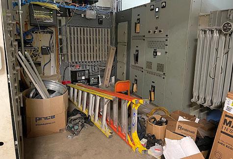 items stored in front of an electrical panel