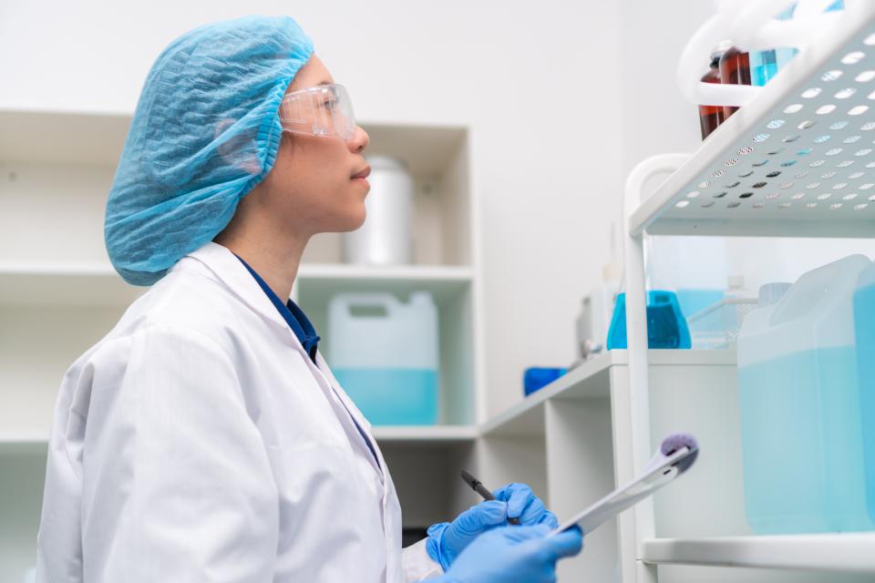 woman reviewing chemicals