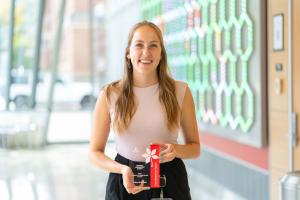 student holding award